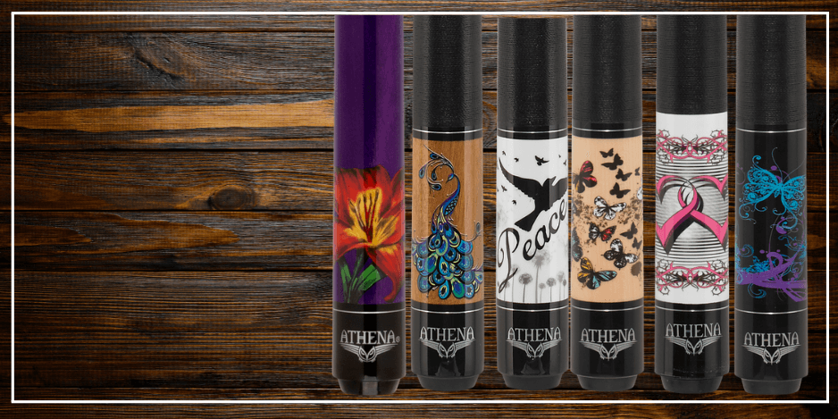 Colorful pool cues on wooden background